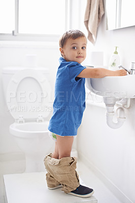 Buy stock photo Child, boy and washing hands in portrait, hygiene and prevention of germs or bacteria in bathroom. Male person, kid and crazy humor or funny joke while potty training, cleaning and sanitary care