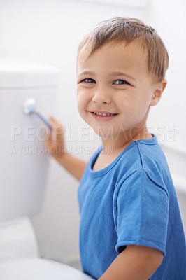 Buy stock photo Boy child, flush toilet and potty training for smile, portrait or pride for development in family home. Kid, bathroom and hygiene with wellness, cleaning or water for waste, dirt or bacteria in house