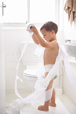 Buy stock photo Shot of a young boy in the toilet