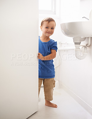 Buy stock photo Shot of a cute little boy in a bothroom