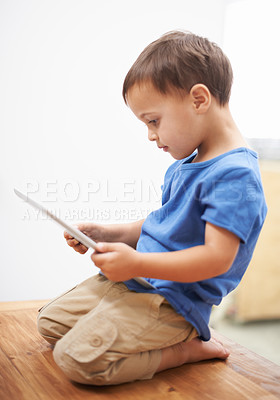Buy stock photo Boy, tablet and typing with games, relax or internet with network, connection or home. Child development, apartment or technology with online educational activity, reading or digital app for learning