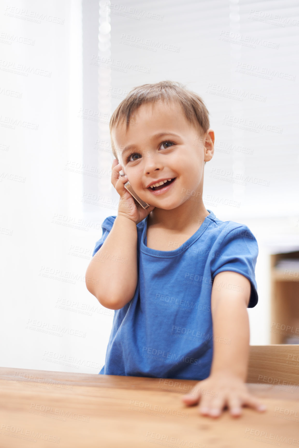 Buy stock photo Toddler, boy and phonecall at home, playing and communication with technology. Happiness, calling and conversation for learning, cellphone and excited for child development, mobile and digital