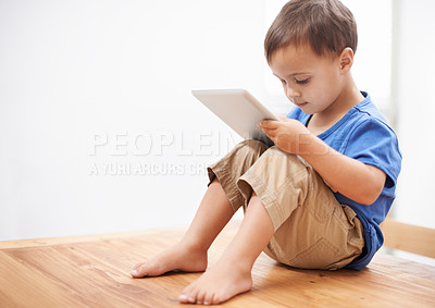 Buy stock photo Boy, tablet and typing with games, home and internet with network, connection and digital app for learning. Child development, apartment and technology with online educational activity, relax and kid
