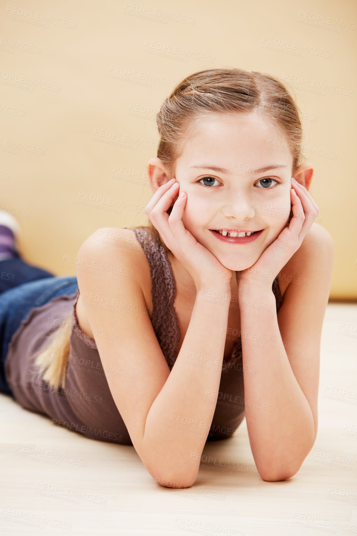 Buy stock photo Child, portrait and smile in studio for fashion confidence on brown background as mockup space, innocence or relax. Female person, model and face of young student for positive mood, cute or style