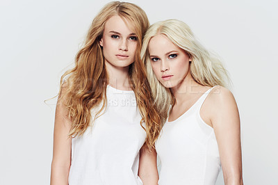 Buy stock photo Studio portrait of two young models against a white background