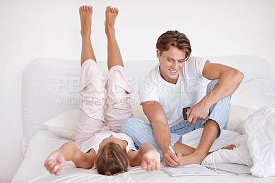 Buy stock photo Relaxing, love and young couple on bed in modern apartment writing together in the morning. Happy, calm and man and woman in marriage bonding, talking and drawing in bedroom at home or house.