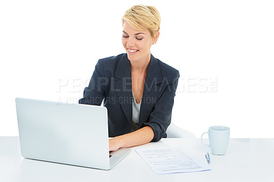 Buy stock photo A young businesswoman working on her laptop
