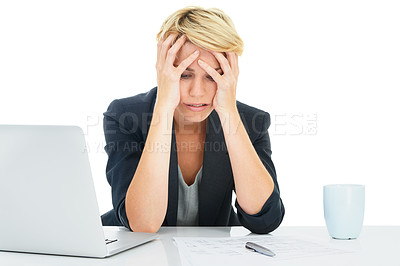 Buy stock photo A young businesswoman looking stressed while working on her laptop