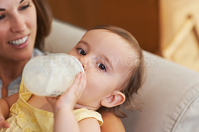 Buy stock photo Baby, bottle and drinking milk, portrait and mom for meal, feeding and kid. Family time, eating and smile for nutrition, hungry and child in home, parent and care for growth, healthy and love 
