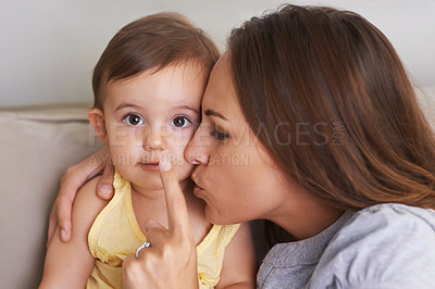 Buy stock photo Baby, mom and portrait on couch, quiet and infant growth with embrace, sitting and home. Girl, happy and healthy in living room, childhood memories and finger on lips with silence, hush or motherhood
