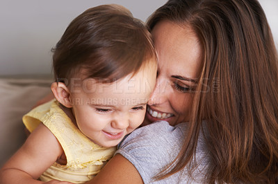 Buy stock photo Shot of an adorable little baby and her mother sharing a cute moment