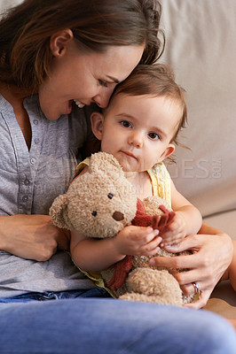 Buy stock photo Mother, baby and happy in embrace at home, love and together for bonding in childhood. Mommy, daughter and support for toddler in child development, mama and security or connection and teddy bear