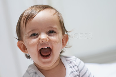 Buy stock photo Baby girl, funny and happy for playing, child development and infant growth with face, sitting and home. Laugh, joyful and healthy in good mood, childhood or cheerful with enthusiasm, kid or adorable