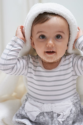 Buy stock photo Cute, smile and portrait of baby with a blanket for playing, sitting and having fun at home. Happy, excited and face of sweet girl kid, child or toddler in a cute casual outfit in nursery at house.