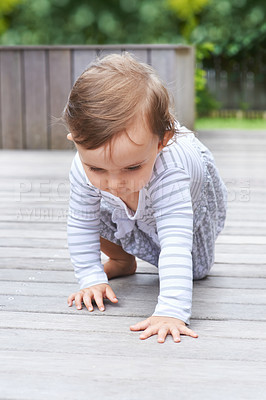 Buy stock photo Baby, crawling and curious on floor, child development and growth with learning, coordination and home. Girl, mobility and healthy in playful, childhood or balance with arms, kid or adorable
