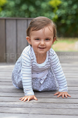Buy stock photo Baby girl, crawling outside and portrait on floor, child development and growth with sensory coordination. Girl, cognition and healthy in good mood, childhood or balance with arms, kid or adorable 
