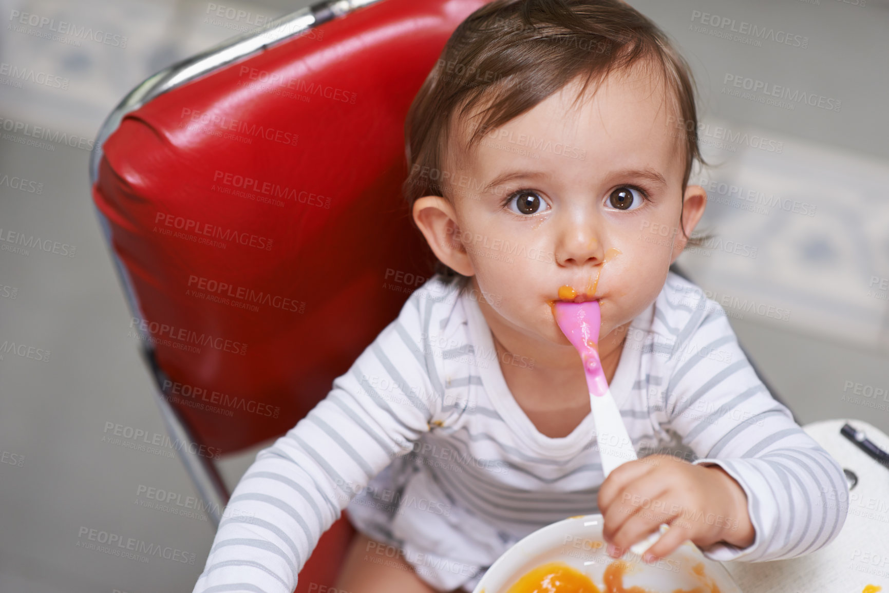 Buy stock photo Eating, cute and portrait of baby in chair with vegetable food for child development at home. Sweet, nutrition and hungry boy kid or toddler enjoying healthy lunch, dinner or supper meal at house.
