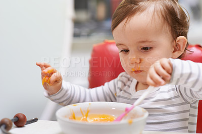 Buy stock photo Baby, high chair and playing with bowl for meal, nutrition or healthy porridge with spoon at home. Young adorable cute little child, kid or toddler eating food for hungry snack, vitamins or nutrients