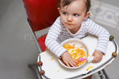 Buy stock photo Baby, girl in high chair with food, nutrition and health for childhood development and wellness. Healthy, growth and toddler at home, feeding vegetable or fruit with hungry kid eating a meal 