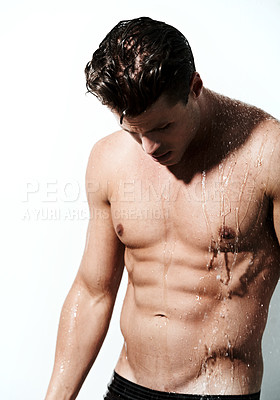 Buy stock photo Shower, shirtless and body of man with water for washing, cleaning and skincare wellness. Sexy, hot and muscular male model with grooming and hygiene for healthy skin by white studio background.