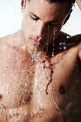 Buy stock photo Man in shower cleaning hair, skin and body for morning wellness, hygiene and routine. Grooming, skincare and face of male model with muscle washing with water, healthy self care and calm in bathroom
