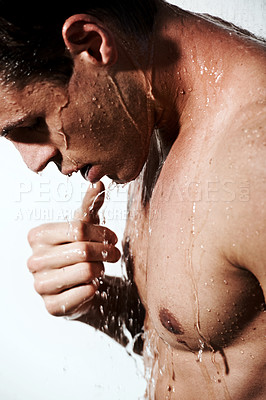 Buy stock photo Profile of man in shower to relax, cleaning hair and body for morning wellness, hygiene and skin routine. Grooming, skincare and male model with muscle washing in water, self care and calm bathroom.