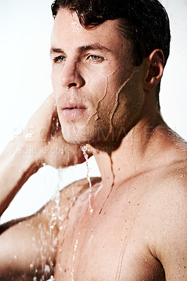 Buy stock photo Face of man in shower to relax, cleaning hair and body for morning wellness, hygiene and skin routine. Grooming, skincare and male model with muscle washing with water, self care and calm bathroom.