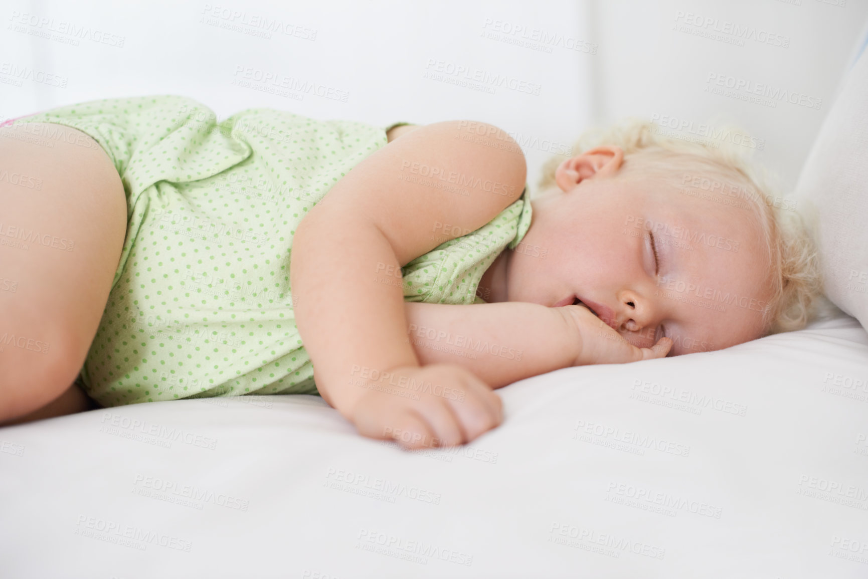 Buy stock photo A cute baby girl fast asleep with her thumb in her mouth