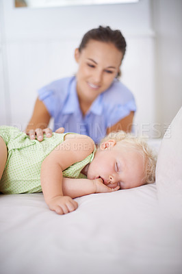 Buy stock photo Smile, sleeping and mother with baby on bed for bonding, relax and sweet cute relationship. Happy, love and young mom watching girl child, kid or toddler taking a nap in bedroom or nursery at home.