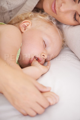 Buy stock photo Mother, baby and kid suck thumb in home, adorable and cute innocent child with parent in house. Young blonde toddler, finger and mouth of healthy little girl sleeping in bedroom together with mama