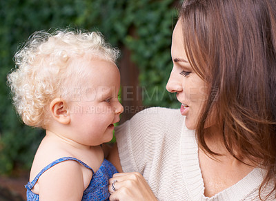 Buy stock photo A young mother holding her adorable baby