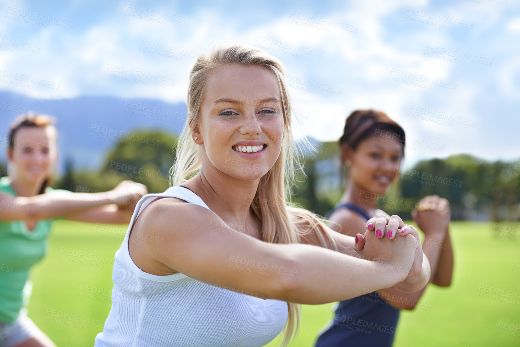 Buy stock photo Woman, portrait and friends with squats for exercise, fitness or training outdoor on sports field with smile. Collaboration, athlete and face with happiness for workout, physical activity or wellness