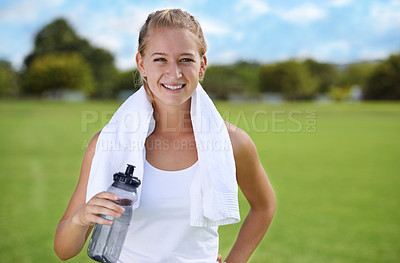 Buy stock photo Happy woman, portrait and water bottle in fitness on green grass for workout, exercise or outdoor training. Face of female person or athlete with towel, drink or liquid for natural sustainability