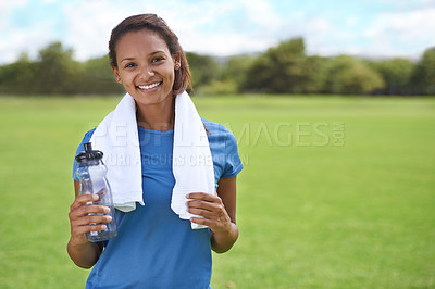 Buy stock photo Woman, portrait and happy on grass with water bottle for exercise, training or workout on sports field. Athlete, person and face with smile for fitness, wellness and healthy body with break and relax