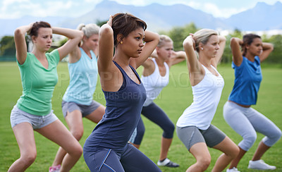 Buy stock photo Women, stretching and squats for exercise outdoor, team and ready for workout with health and wellness. Training together on sports field, young athlete group warm up and fitness in the park