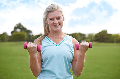 Buy stock photo Woman, portrait and dumbbells outdoor for exercise with smile for workout, training or fitness on sports field. Athlete, person and happy for physical activity or blue sky on grass with equipment