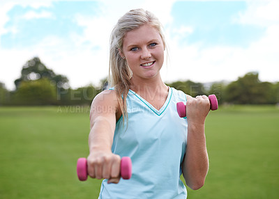 Buy stock photo Woman, portrait and dumbbell outdoor for weightlifting with smile for workout, training or fitness on field. Athlete, person and happy for physical activity or healthy body on grass with equipment