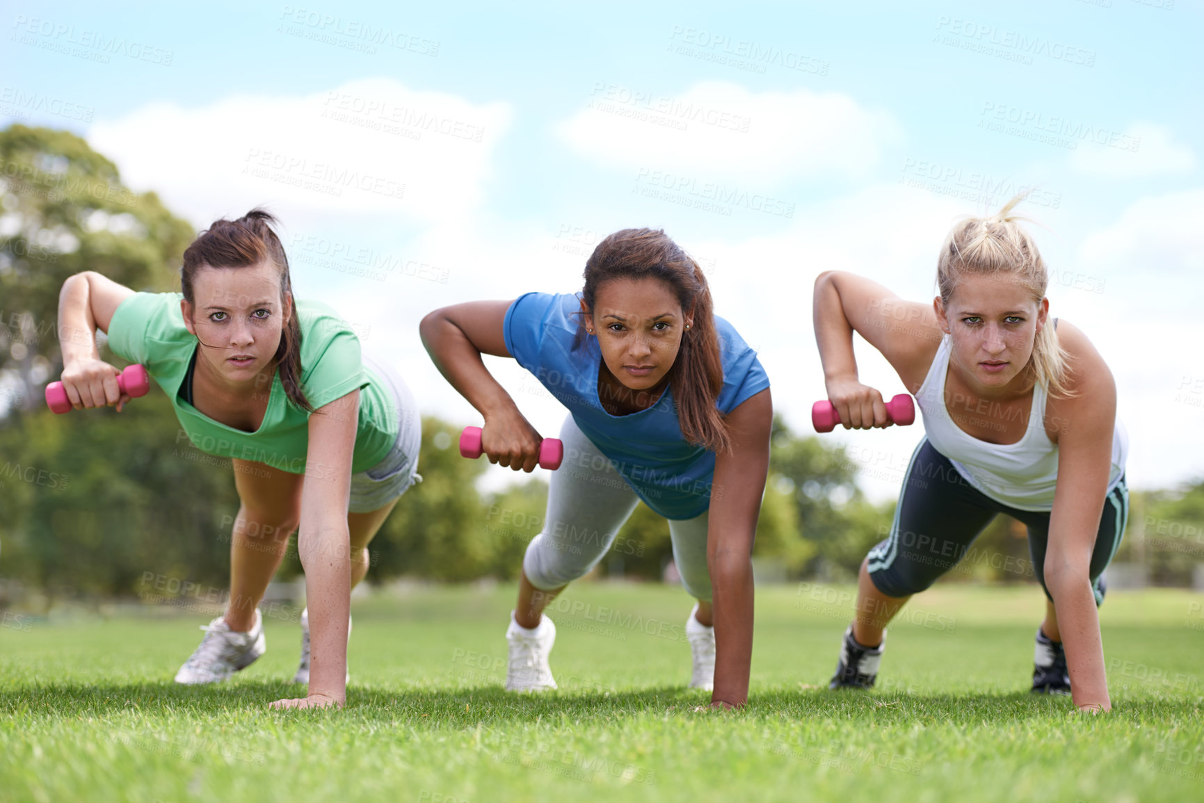 Buy stock photo Teenager, girl with dumbbells and push up for fitness and muscle, strong athlete group outdoor for sport and bodybuilding. Portrait, exercise equipment in park and bodybuilder team workout together