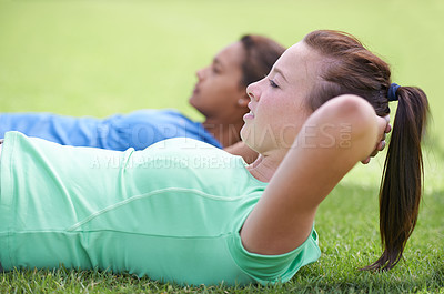 Buy stock photo Woman, sit ups and workout on green grass for fitness or outdoor exercise together in nature. Young active female person or people in core, abs or strength training while lying on field outside