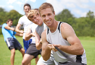 Buy stock photo Rope, pull and men portrait with teamwork, tug of war and fitness outdoor on sport field. Training, workout and athlete group with support together for competition and strong arm exercise for health