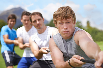 Buy stock photo Rope, pull and men portrait with strong teamwork, tug of war and fitness outdoor on sport field. Training, workout and athlete group with support together for competition and arm exercise for health
