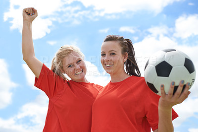 Buy stock photo Happy woman, portrait and friends in celebration with soccer ball for winning, achievement or victory. Female person or team of football players smile with fist pump for award or goals with blue sky