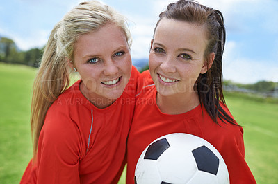 Buy stock photo Girls, soccer players and portrait with ball, field and football pitch for match, competition or game. Fitness, practice and ready for training, outdoor and exercise for athlete, happy and sport
