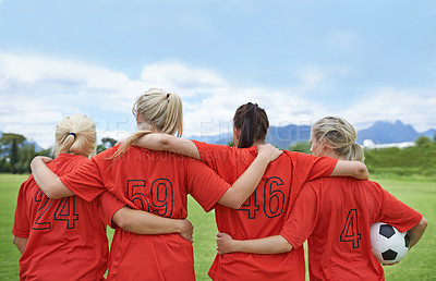 Buy stock photo Woman, back and hug in soccer of sports team ready for match, game or outdoor practice with blue sky. Rear view of female person or group of football players standing in unity with ball in nature