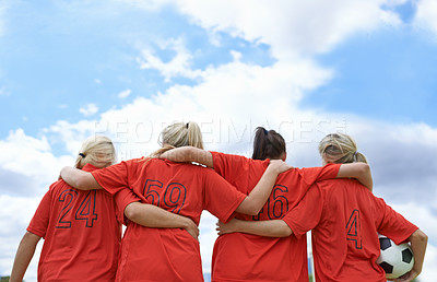Buy stock photo Woman, hug and back of soccer team ready for sports match, game or outdoor practice with blue sky. Rear view of female person or group of football players standing in unity with ball in nature