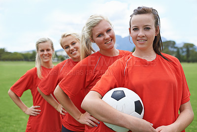 Buy stock photo Portrait of a young female soccer player and her teammates