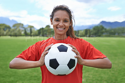 Buy stock photo Shot of a young female soccer player holding a soccer ball