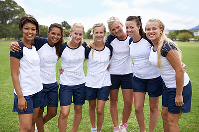Buy stock photo An all girls sports team standing together on the field