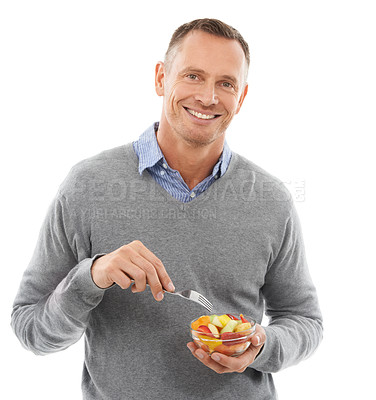 Buy stock photo Portrait, studio and man eating a fruit salad for a healthy snack, diet meal or craving. Happy, smile and male model enjoying fresh produce for health and wellness isolated by white background.