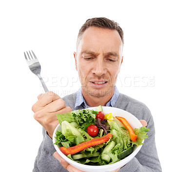 Buy stock photo Man with salad, frown on face and vegetables, problem with healthy lifestyle and diet isolated on white background. Health, wellness and male with doubt about food choice, nutrition in studio